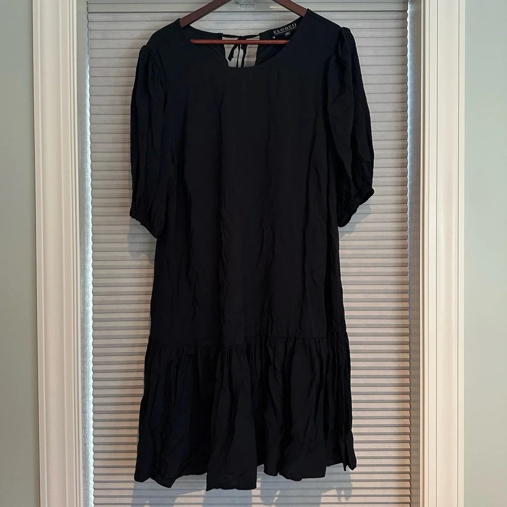 Black tiered mini dress with tie back